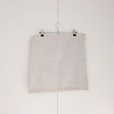 Beige ribbed cushion cover