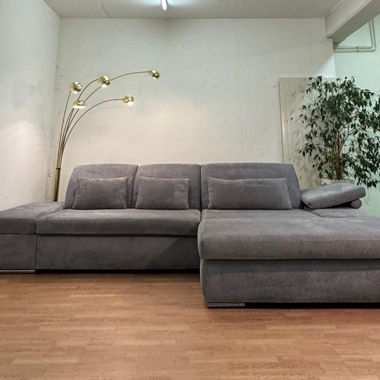 Corner sofa with adjustable armrest and headrest
