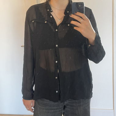 Blusa nera trasparente