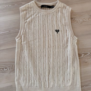 Maglione beige senza maniche