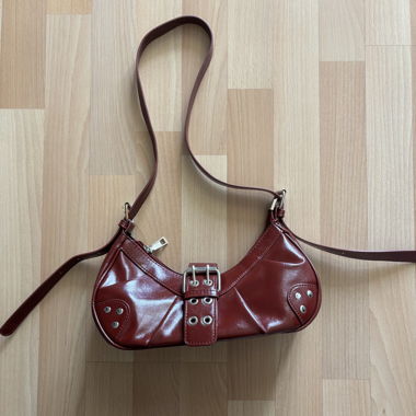 Red shoulder bag with studs