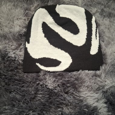 Black beanie with white abstract pattern