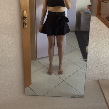Black short skirt with bow