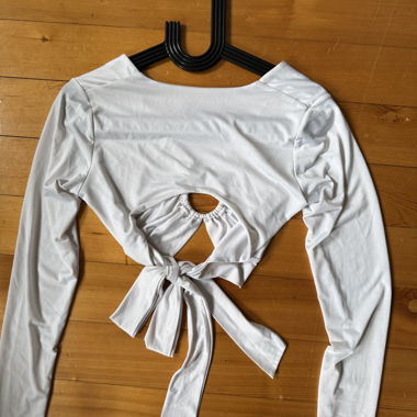 White top with ring and open back