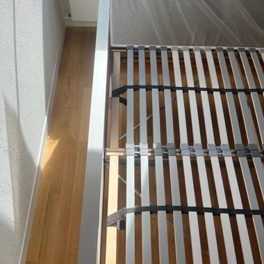 White wooden bed frame