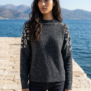 Dark knit sweater with rhinestone appliqués