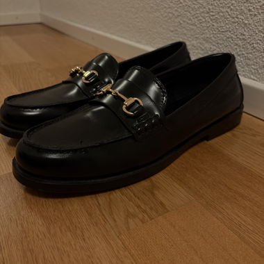 Black leather loafers