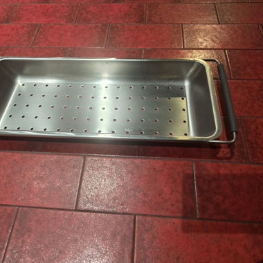 Perforated stainless steel tray with handles