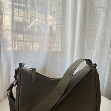 Olive green shoulder bag with logo strap