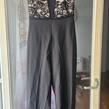 Elegant black jumpsuit with lace bodice