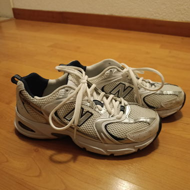 White and silver New Balance sneakers