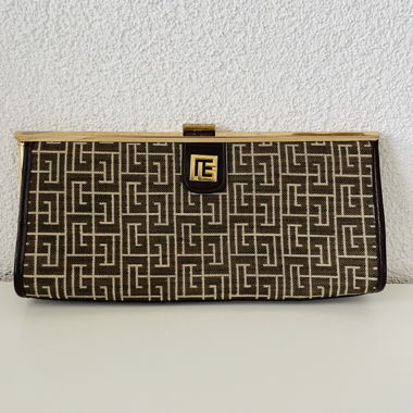 Brown patterned clutch with gold frame