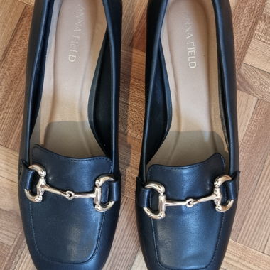 Black loafers with metal strap