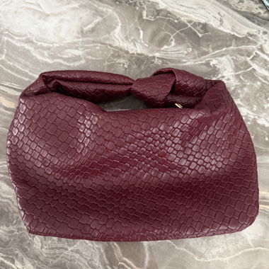 Sac à main bordeaux tressé
