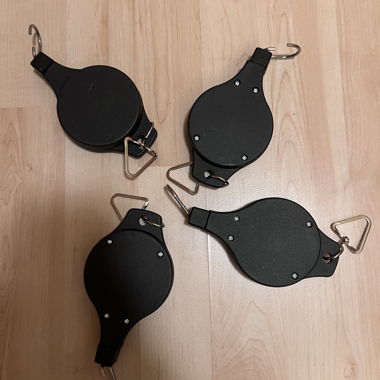 Retractable pulleys for hanging plants
