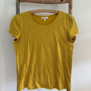 Yellow T-shirt with white pineapples