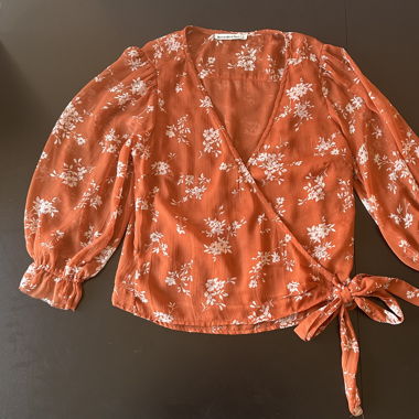 Orange, floral wrap blouse