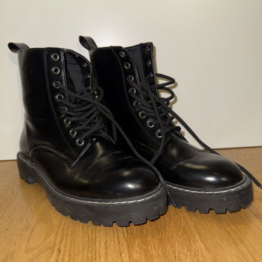 Black lace-up boots with lug sole