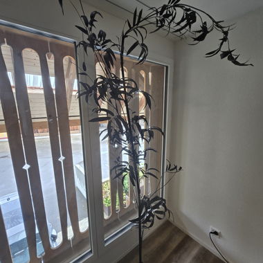 Decorative black artificial plant