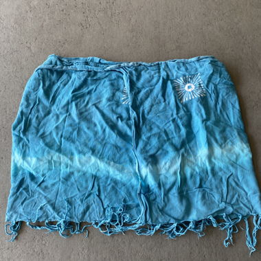 Blue tie-dye wrapping skirt with fringe hem 