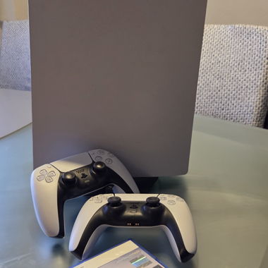 PS5 console with 2 controllers and 5 games 