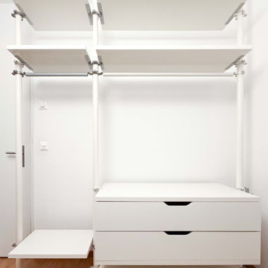 White clothing racks with drawers