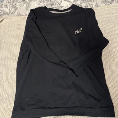 Sweater with small lettering