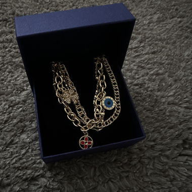 Gold bracelet with charms