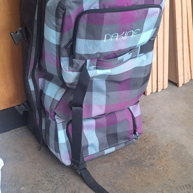 Large Dakine suitcase