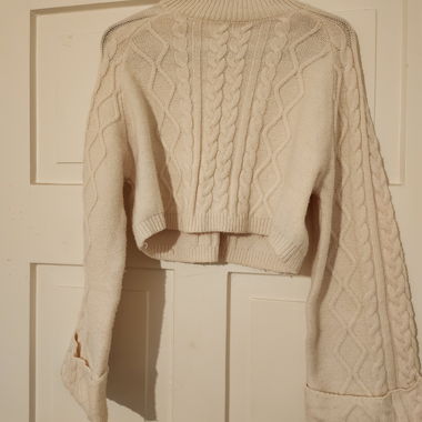 Cream cable-knit sweater