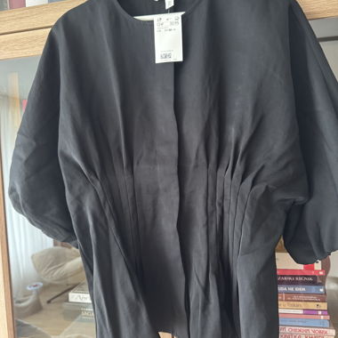 Blusa nera plissettata