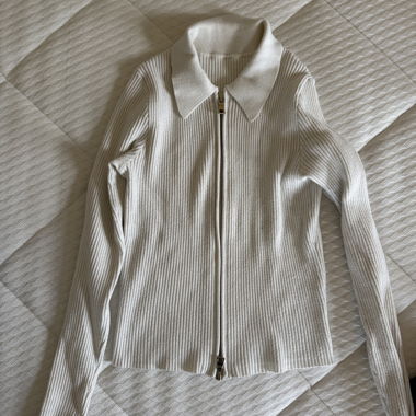 Veste en tricot blanche à fermeture éclair