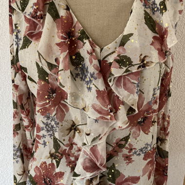 Blusa floreale con volant