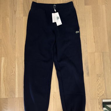 Tuta Lacoste blu scuro mai indossata
