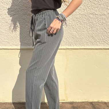 Grey trousers with thin white line