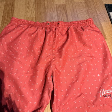 Red swim trunks with anchor pattern