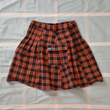 Mini-Plisseerock mit Karos in Orange und Schwarz