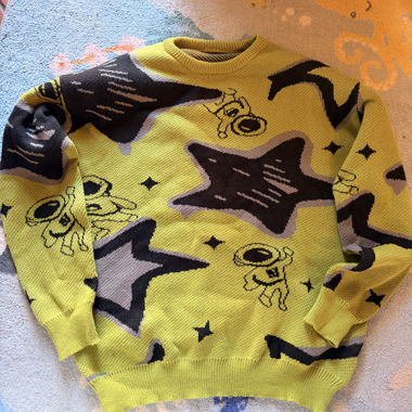 Pull vert à motifs