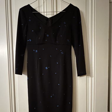 Elegant black dress with blue embroidery. New.
