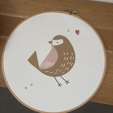 Quadro con uccello in cornice di legno