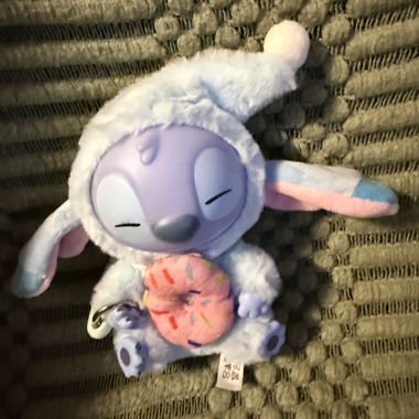 Plush figure with stitched hat