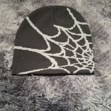 Black knit beanie with spiderweb pattern
