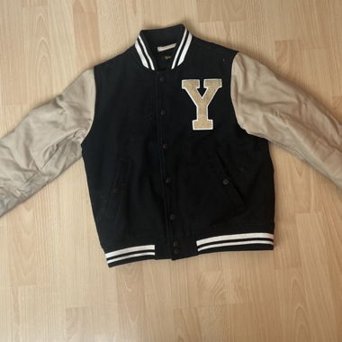 Black college jacket with lettering
