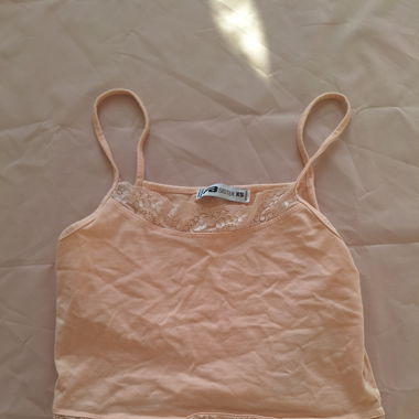 Cute peach coloured lacey tank top