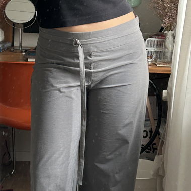 Grey, slightly shiny trousers