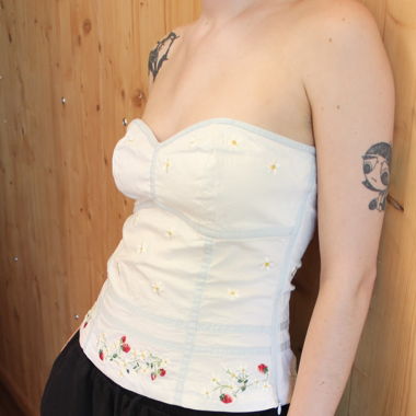 white flowery bustier