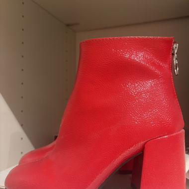 Red heeled ankle boots