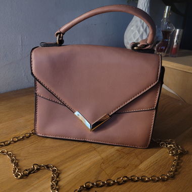 Blush pink handbag with gold details