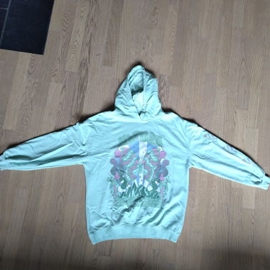 Sweat à capuche turquoise avec imprimé papillon