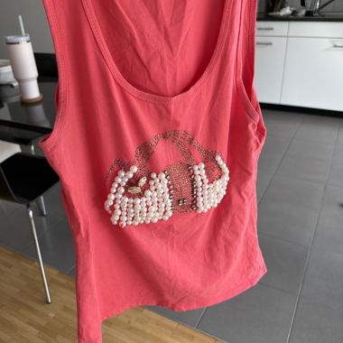 Top senza maniche rosa con strass